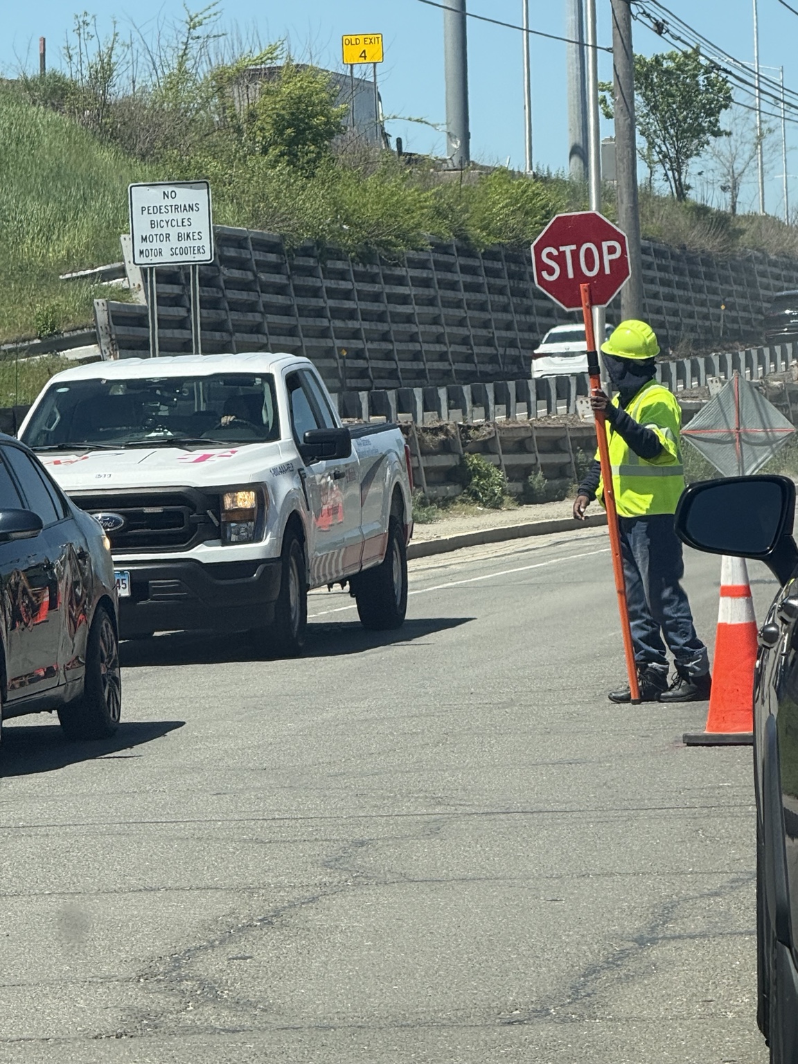 Stop & Go crew member directing traffic at a Connecticut work zone